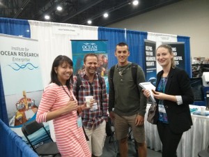 Dr. Cooke with some grad students visiting the OTN table